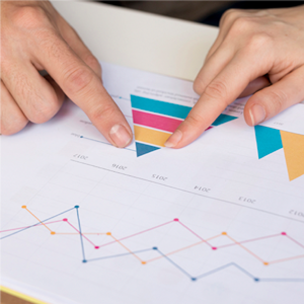 Fingers Pointing at Paper with Graphs