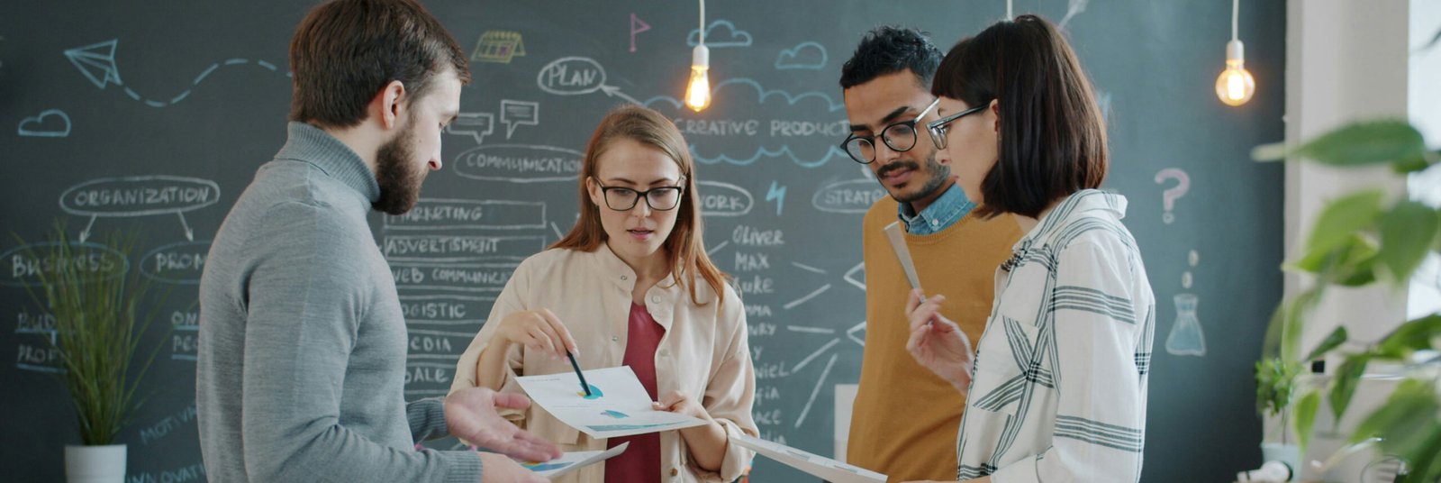 Woman Discussing Chart with Peers